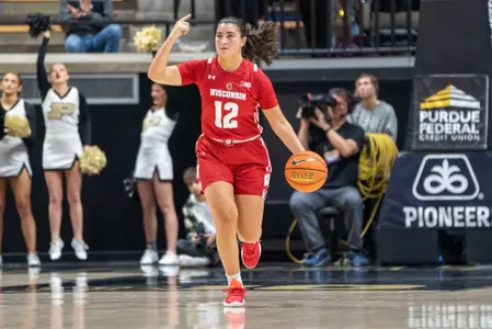 Avery LaBarbera bringing the ball up the court, calling a play