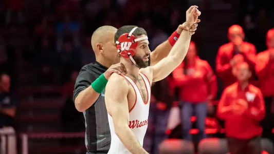 Wisconsin wrestler Eric Barnett has his arm raised by the referee after a 15-0 technical fall against Penn State's Gary Steen on Friday, Jan. 6, 2023 at the UW Field House in Madison, Wis.