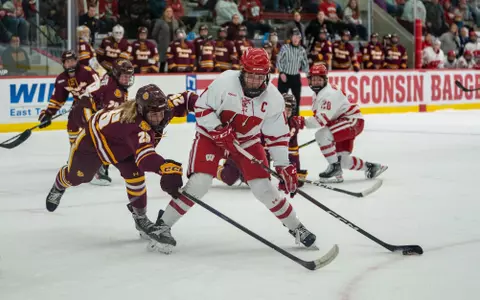 Britta Curl handles a puck against Minnesota Duluth in a WCHA matchup on Jan. 8, 2023 at LaBahn Arena