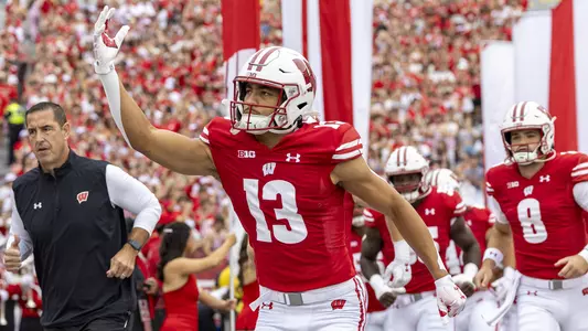 Wisconsin Badgers wide receiver Chimere Dike (13) leads the team onto the field prior to an NCAA college football game against the Georgia Southern Eagles, Saturday, Sept. 16, 2023, in Madison, Wis. The Badgers won 34-14. (Photo by David Stluka/Wisconsin Athletic Communications)
