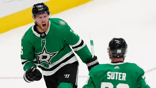 Former Badgers and Dallas Stars teammates Joe Pavelski and Ryan Suter celebrate scoring a goal.