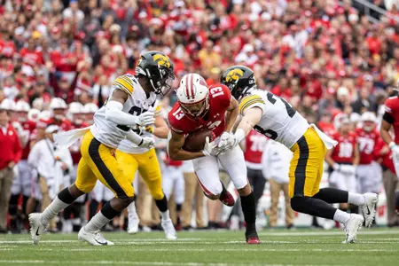 Wisconsin Badgers wide receiver Chimere Dike (13) handles the ball during an NCAA college football game against the Iowa Hawkeyes, Saturday, Oct. 30, 2021, in Madison, Wis. The Badgers won 27-7. (Photo by David Stluka/Wisconsin Athletic Communications)