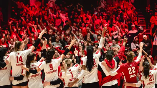 Team signs varsity with fans after match vs Rutgers