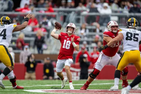 Wisconsin Badgers quarterback Braedyn Locke (18) throws the ball during a Big Ten Conference NCAA college football game against the Iowa Hawkeyes, Saturday, Oct. 14, 2023, in Madison, Wis. The Hawkeyes won 15-6. (Photo by David Stluka/Wisconsin Athletic Communications)
