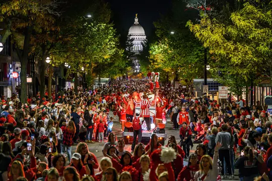 Bucky and the Spirit Squad rally the crowd as floats and performers travel down State Street during the University of Wisconsin–Madison’s Homecoming Parade on Oct. 21, 2022. The annual parade is one of many Homecoming-week activities sponsored by the Wisconsin Alumni Association (WAA) and the Wisconsin Union. (Photo by Althea Dotzour / UW–Madison)