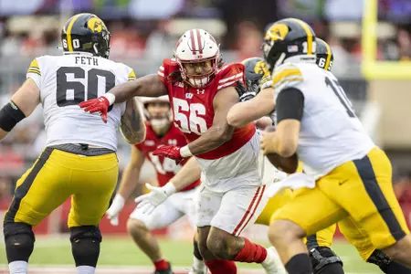 Wisconsin Badgers defensive lineman Rodas Johnson (56) pressures the quarterback during a Big Ten Conference NCAA college football game against the Iowa Hawkeyes, Saturday, Oct. 14, 2023, in Madison, Wis. The Hawkeyes won 15-6. (Photo by David Stluka/Wisconsin Athletic Communications)
