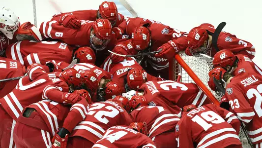 The Wisconsin men's hockey team forms a huddle before a game versus Michigan Tech.