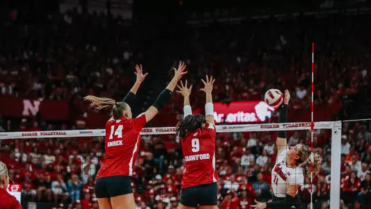 CC Crawford and Anna Smrek block the ball during match at Nebraska