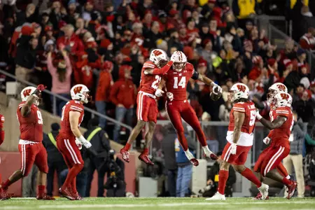 Wisconsin Badgers' safety Preston Zachman (14) and cornerback Jace Arnold (22) celebrate an interception during a Big Ten Conference NCAA college football game against the Ohio State Buckeyes on Saturday, Oct. 28, 2023, in Madison, Wis.
