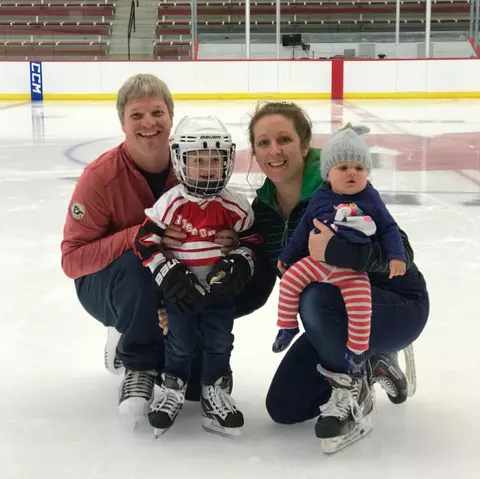 Sharon (Cole) Faust and husband Jesse with their two children on the ice