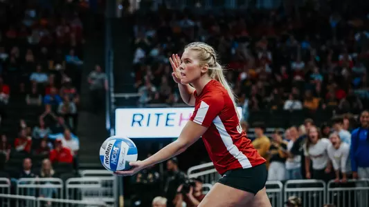 Saige Damrow serves the ball in match vs Marquette