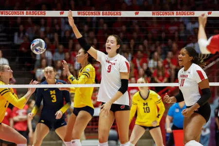 CC Crawford celebrates after winning a point in match vs Michigan