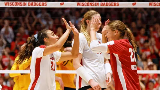 GG and Julia Orzol celebrate in match against Michigan