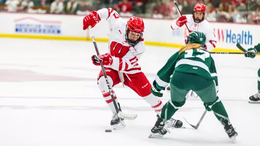 Britta Curl weaves through Bemidji State players to get to the net