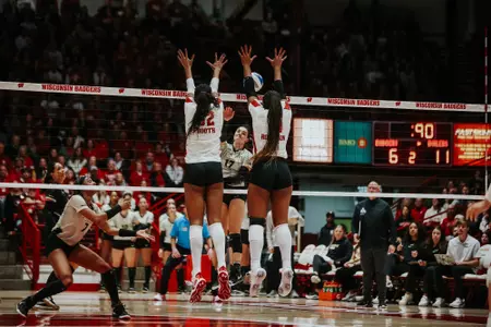 Carter Booth and Devyn Robinson go up for the block against Purdue