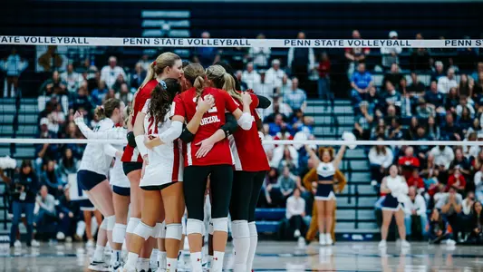 Badgers huddle after a point in match at Penn State