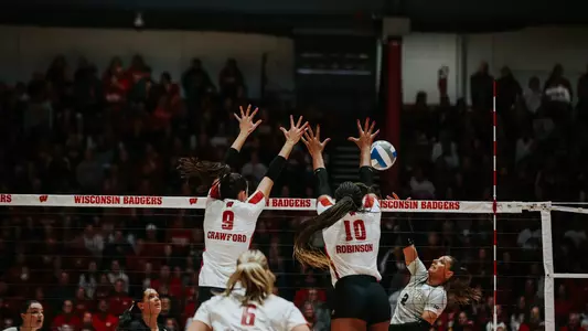 CC Crawford and Devyn Robinson block the ball in match vs Purdue