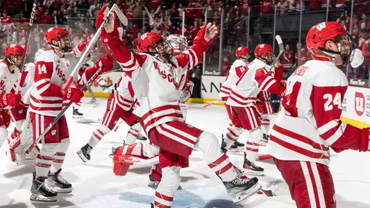 Mathieu De St. Phalle and the Wisconsin men's hockey team celebrate a win at the Kohl Center.