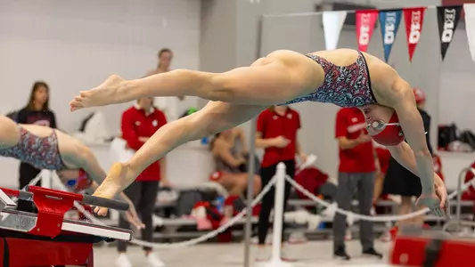 Alivia Lindorfer dives into the pool at the start of a race.