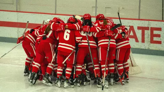 Wisconsin women's hockey huddles around the net before a game against Ohio State on Nov. 17