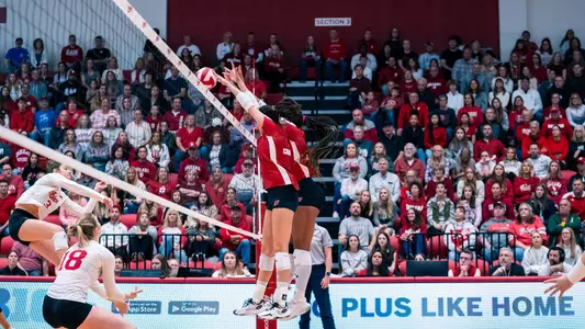 CC Crawford and Devyn Robinson block the ball