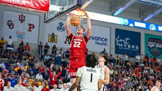 Steven Crowl (22) dunks the ball against Virginia