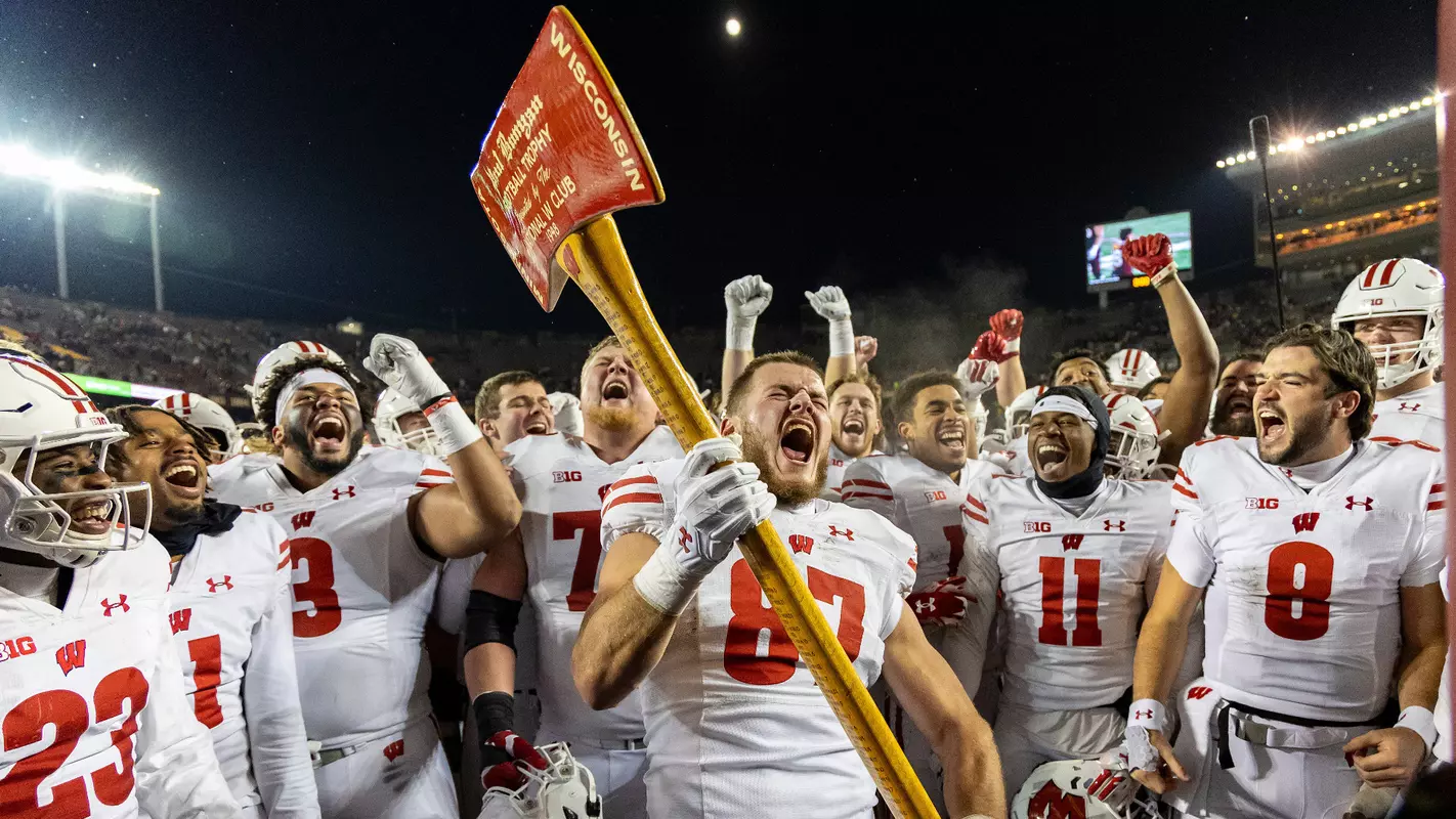 Wisconsin Badgers celebrate with the Axe after a Big Ten Conference NCAA college football game against the Minnesota Golden Gophers, Saturday, Nov. 25, 2023, in Minneapolis, Min. (Photo by David Stluka/Wisconsin Athletic Communications)