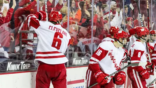 Members of the Wisconsin men's hockey team celebrate a win over Alaska Anchorage.