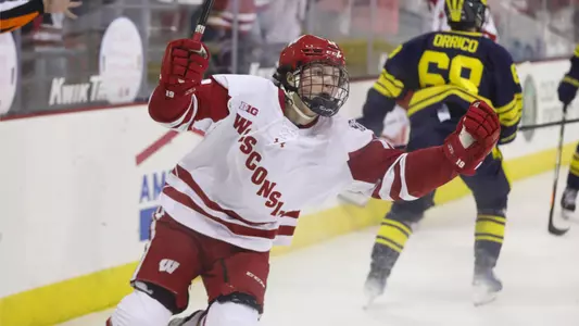 Quinn Finley celebrates scoring a goal versus Michigan at the Kohl Center.