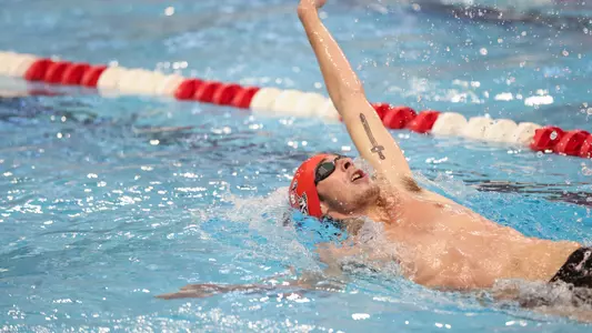 Jake Newmark competes in the backstroke