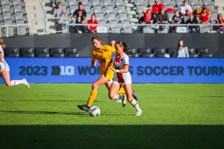 Aryssa Mahrt runs alongside an Iowa player