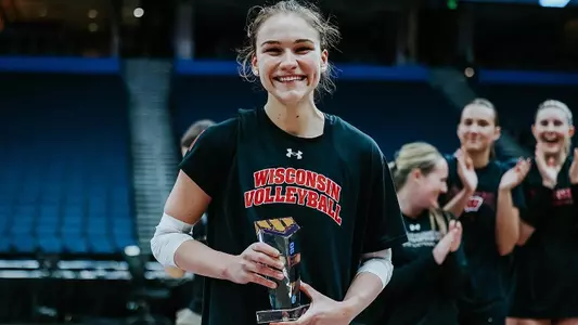 Julia Orzol poses with her Elite 90 award