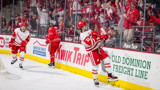 Jack Horbach celebrates a goal along with teammate Owen Lindmark and the Kohl Center crowd