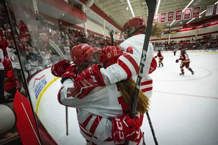 Wisconsin Badgers' forward Lacey Eden (6) embraces her teammates during the Wisconsin women's hockey game vs. Minnesota Duluth at LaBahn Arena on Dec. 2.