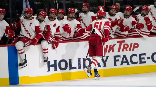 Cruz Lucius celebrates a goal at the 2022 Kwik Trip Holiday Face-Off