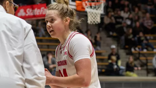 Natalie Leuzinger talking to Coach Moseley