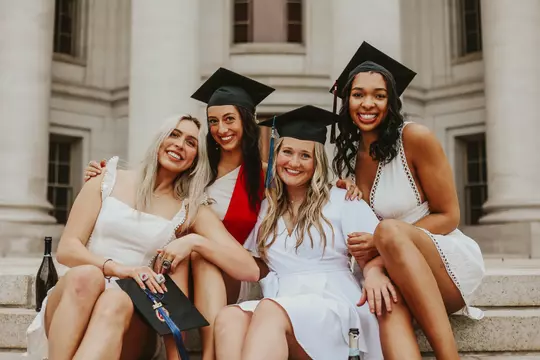 Joslyn Boyer and Wisconsin volleyball teammates in graduation caps and gowns