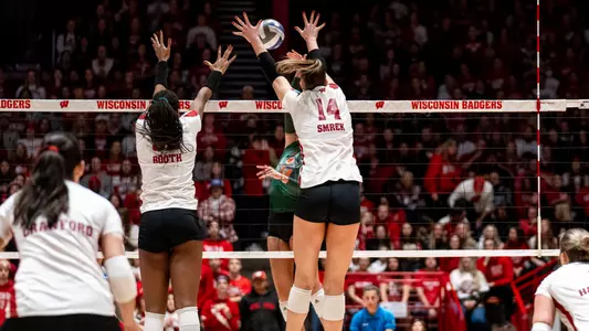 Carter Booth and Anna Smrek go up for a block