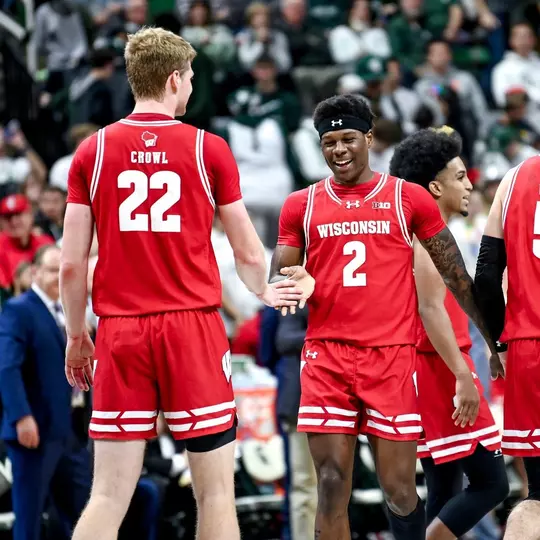 AJ Storr (2) and Steven Crowl (22) against Michigan State