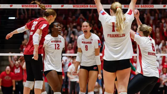 The Badgers celebrate a point on the court