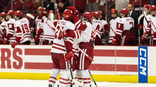 The Wisconsin men's hockey team celebrates Carson Bantle's hat trick.