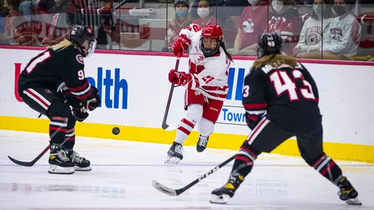 Maddi Wheeler skates the puck against St. Cloud State during the 2021-22 season