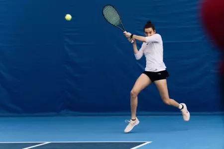 Ava Markham returns the ball during a match