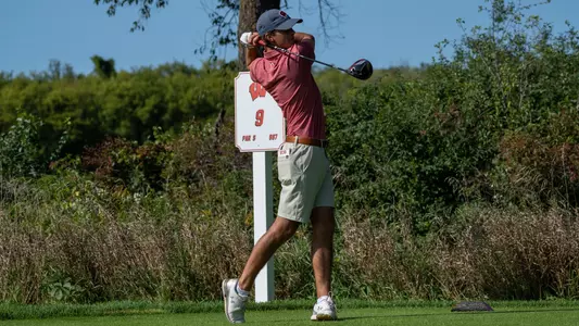 Cameron Huss of Wisconsin men's golf finishes a swing at the 2022 Badger Invitational