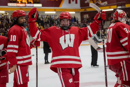 Caroline Harvey celebrates a win at Minnesota