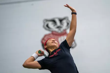 Charmaine Seah serves during a match
