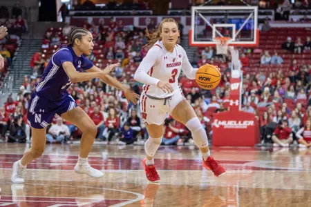 Brooke Schramek drives against a Northwestern defender.