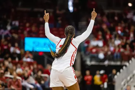 Serah Williams celebrates, as she points to the sky with both hands.