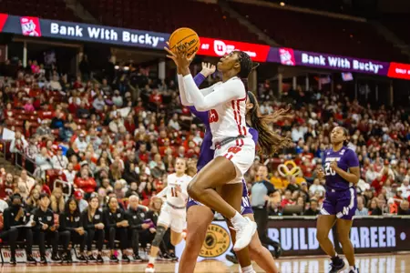 Serah Williams shoots a contested layup with her left hand.