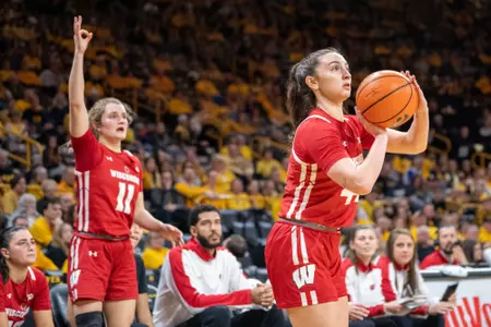 Mary Ferrito shoots a three-pointer shot from the corner.